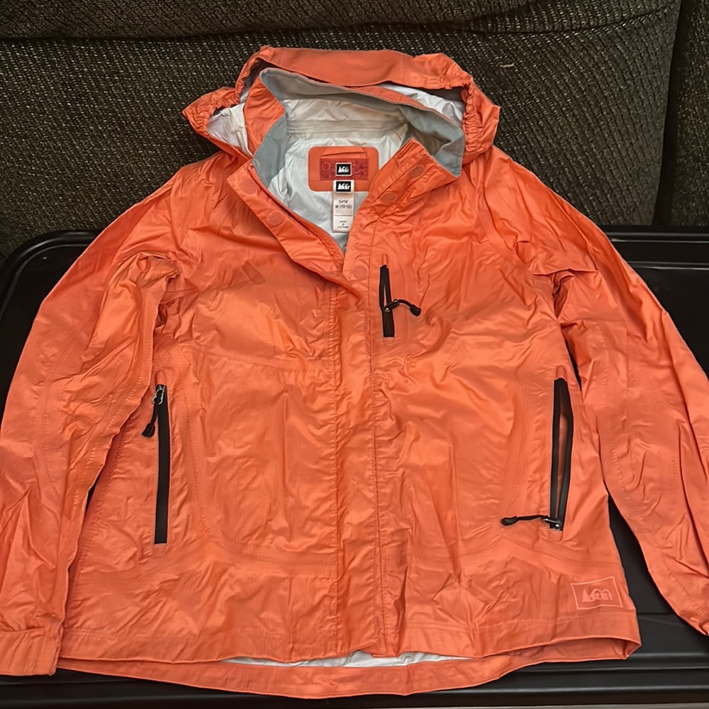 REI Girls’ orange rain jacket